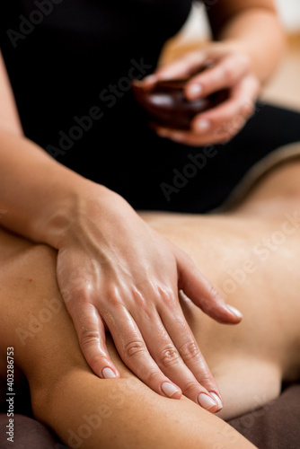 Sensual tantric massage in the cozy atmosphere of a beauty salon by a professional massage therapist