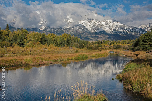 Snow capped mountains of the Grand Tetons scenic in fall season.