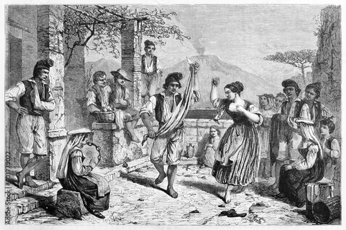 Italian people having party dancing Tarantella outdoor in traditional clothes (Neapolitan folk dance), Italy. Ancient grey tone etching style art by Bergue, Le Tour du Monde, 1861