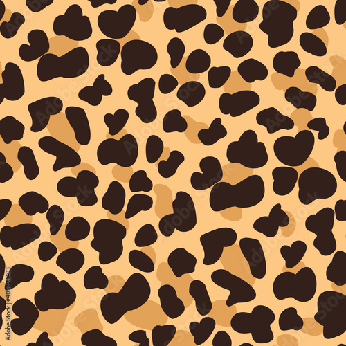 Golden brown spots on beige leopard pattern design. Animal seamless texture.