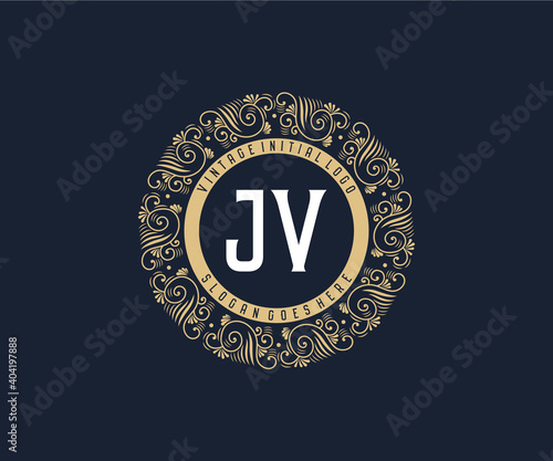 Initial JV Antique retro luxury victorian calligraphic emblem logo with ornamental frame.