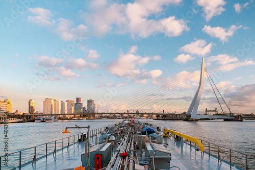 Binnenvaart, Translation Inlandshipping on the river Nieuwe Maas Rotterdam Netherlands during sunset hours, Gas tanker vessel Rotterdam oil and gas transport. Netherlands