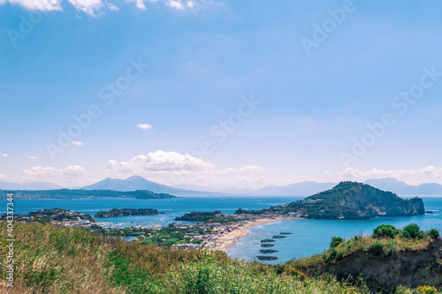 view of the sea in the gulf of Naples from Monte di Procida with the volcano Vesuvius in the background and Bacoli closer