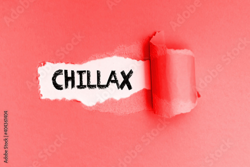 New vulgar English word Chillax written on torn yellow paper.
