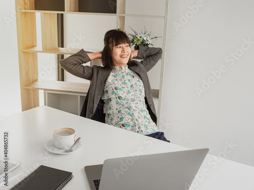 A businesswoman is relax moot after having a cup of coffee in aternoon, tea and coffee break time. relaxing from work, to release stressfulness, refreshing from workload. business successfull person