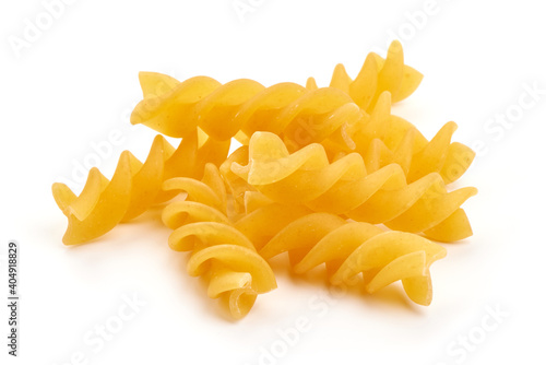 Raw fusilli pasta, close-up, isolated on white background