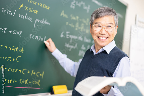 Senior professor teaching calculus