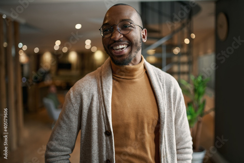 Portrait of creative trendy black african male designer laughing