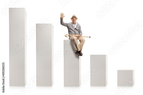 Elderly man sitting on a column from a chart and greeting with hand