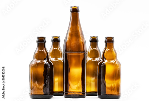 A row of empty brown bottles