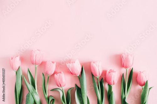 Beautiful composition spring flowers. Bouquet of pink tulips flowers on pastel pink background. Valentine's Day, Easter, Birthday, Happy Women's Day, Mother's Day. Flat lay, top view, copy space