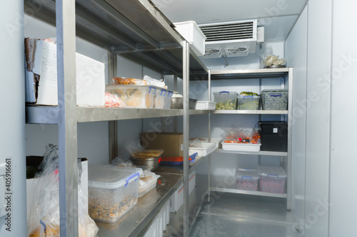 Refrigerator chamber with steel shelves in a restaurant