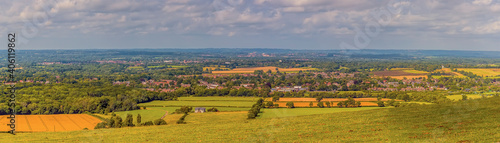 A panorama view from the top of the South down across the Weald near Brighton, UK in summertime