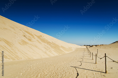 Moving dunes at sunny day, Slowinski National Park, Leba. Sand and blue sky
