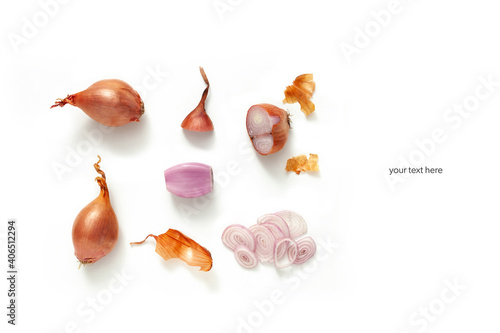 whole and cut shallot on white background. Top view layout