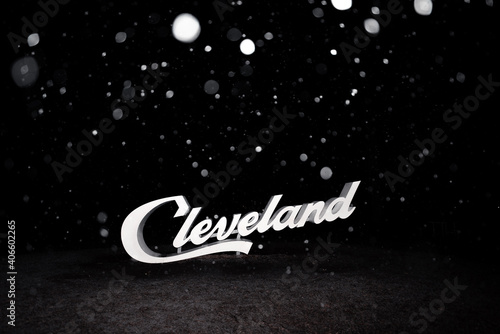 Cleveland script sign in the snow