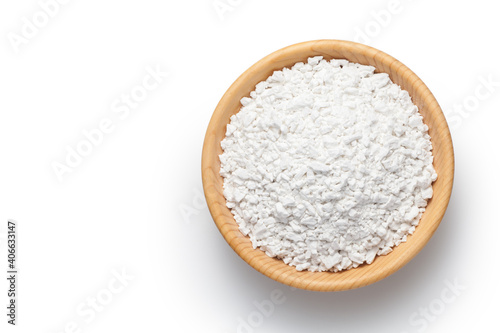 Sweet potato starch in a wooden bowl isolated on white background. Top view.