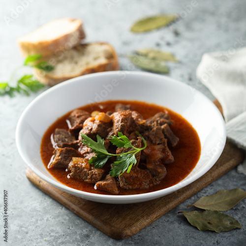 Traditional homemade beef goulash with fresh parsley