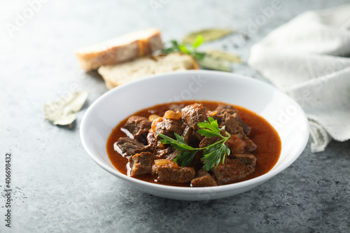 Traditional homemade beef goulash with fresh parsley