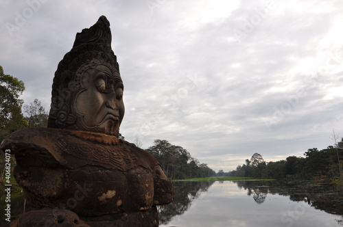 Moody stone face over a bridge at Angkor Wat