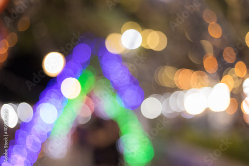 Christmas and New Year background. Glowing Holiday Abstract Defocused Background With Snowflakes and Stars. Blurred Bokeh