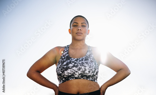 Confident plus size female model in sportswear