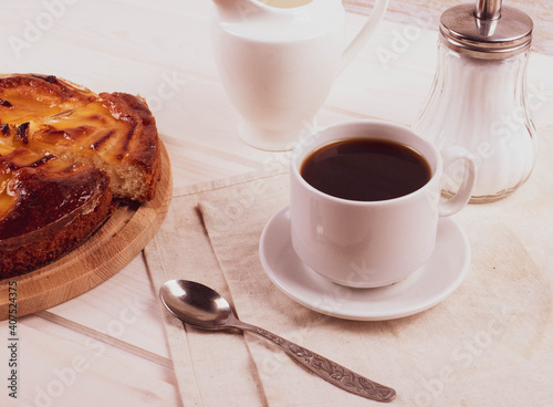 traditional homemade baked cake or tart and espresso in a cup
