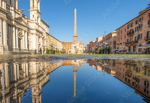 Rome, Italy - in Winter time, frequent rain showers create pools in which the wonderful Old Town of Rome reflect like in a mirror. Here in particular Piazza Navona