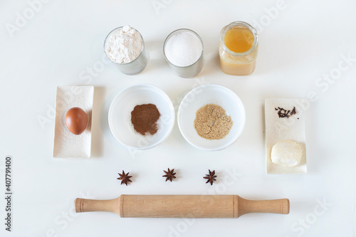 ingredients for making cookies, flour in a glass, sugar, honey, butter, badian, egg, caoritsa, ginger, badian