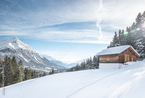 Snow covered cabin in de the alps