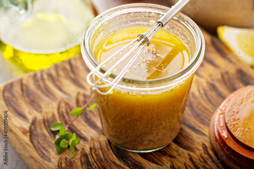 Homemade greek salad dressing or marinade in a glass jar