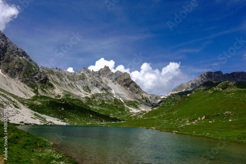 wonderful mountain valley with a lake and blue sky