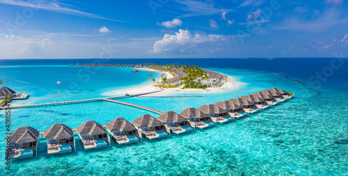 Maldives paradise scenery. Tropical aerial landscape, seascape with long jetty, water villas with amazing sea and lagoon beach, tropical nature. Exotic tourism destination banner, summer vacation