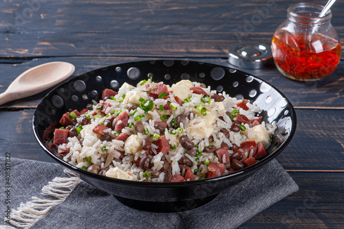 .Brazilian food called Baião de Dois. Very common in the north of the country. Made with rice, beans, sausage and rennet cheese.