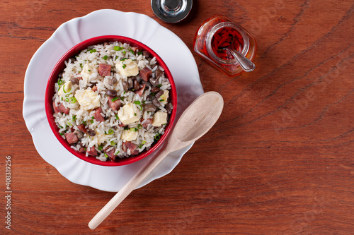 .Brazilian food called Baião de Dois. Very common in the north of the country. Made with rice, beans, sausage and rennet cheese.