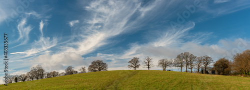 Panoramic landscape of Harrow Weald hills and fields in sunny winter day, England 