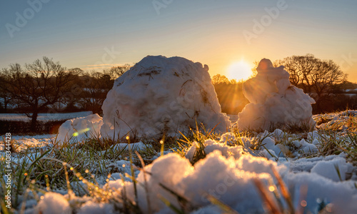 Snow and snow balls on a field of Harrow Weald in a sunny morning, England 