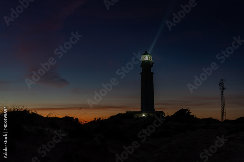 the Cape Trafalgar lighthouse signal light after sunset with colorful evening sky