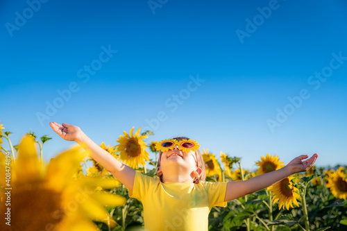 Happy child playing outdoor in spring field