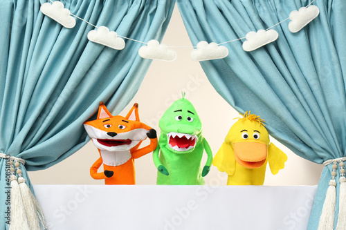 Creative puppet show on white stage indoors