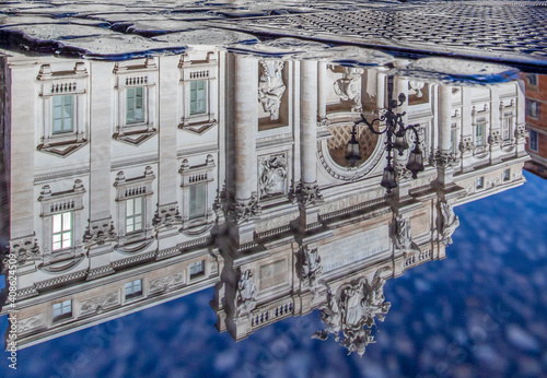 Rome, Italy - in Winter time, frequent rain showers create pools in which the wonderful Old Town of Rome reflect like in a mirror. Here in particular the Trevi Fountain