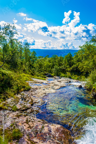 Amazing norwegian landscape beautiful colorful turquoise river waterfall Vang Norway.