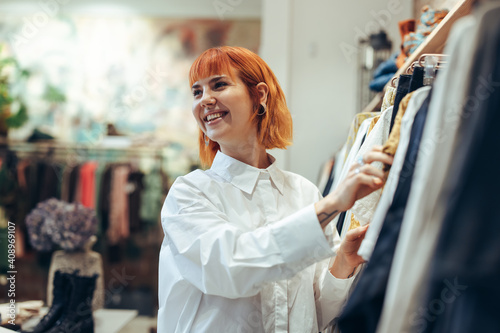 Woman enjoying shopping in fashion store