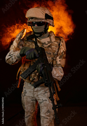 a soldier on fire holding a gun. Fight against terrorism