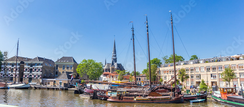 Panorama of old wooden sailing ships in the harbor of Gouda, Netherlands