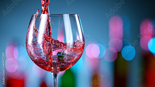 Pouring red wine in a bar, close-up.