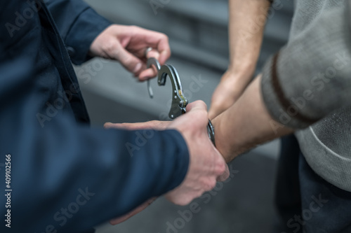 handcuffing the arrested person. Implementation of the arrest