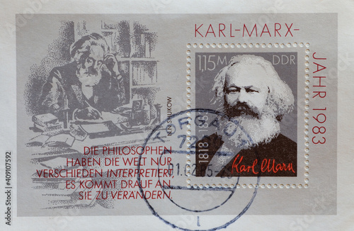 GERMANY, DDR - CIRCA 1983 : a postage stamp from Germany, GDR showing a portrait of Karl Marx on the 100th anniversary of his death. On a postal stamp pad