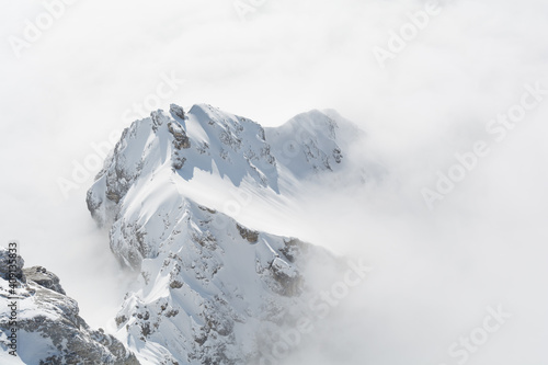 Sunny Mountain Of The Dachstein Mountain Range Stands Out In The Mist Carpet