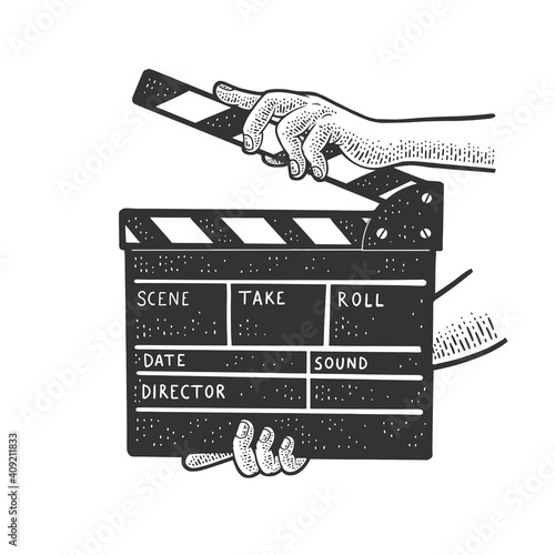 Movie clapperboard in hands sketch engraving vector illustration. T-shirt apparel print design. Scratch board style imitation. Hand drawn image.